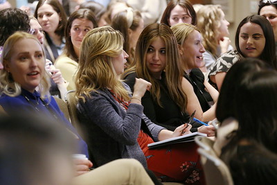 people in audience talking to each other